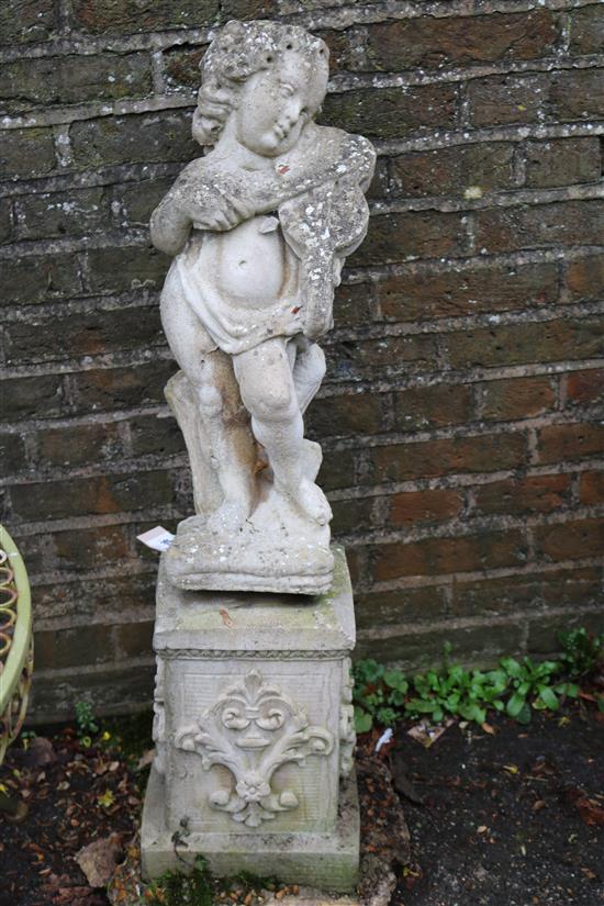 Small stonework figure of a child with a violin
